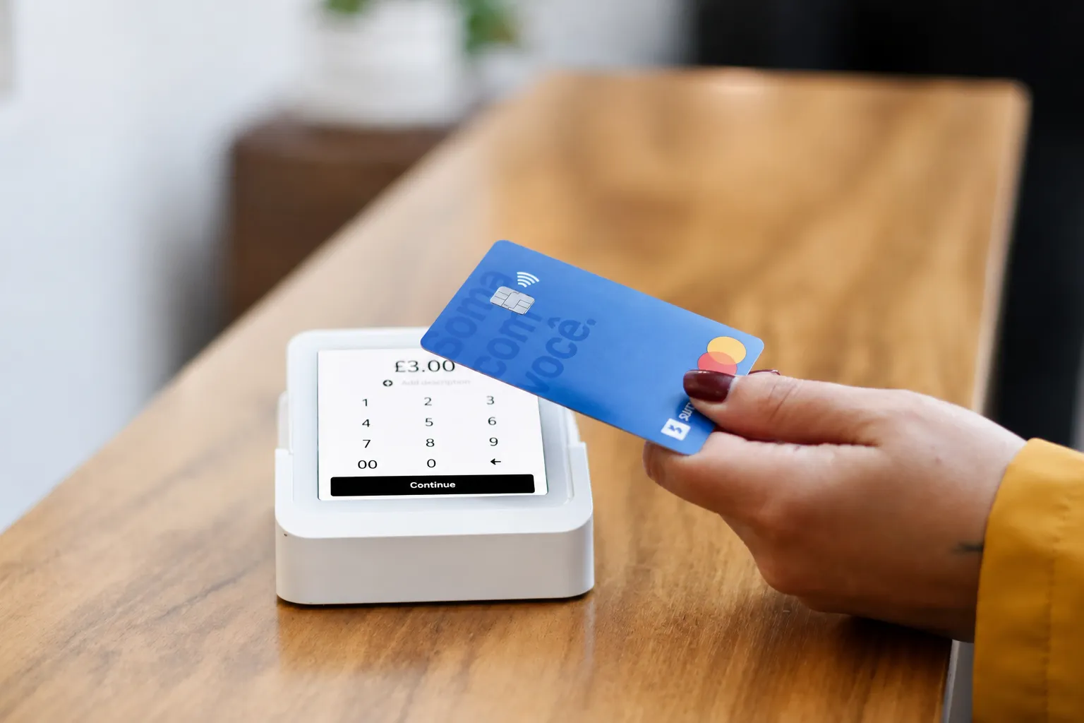 SumUp card reader being used to accept a card payment